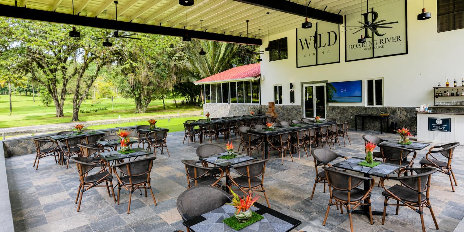 The resort's Wild Dining venue offers a relaxing setting to enjoy local cuisine overlooking the golf course.